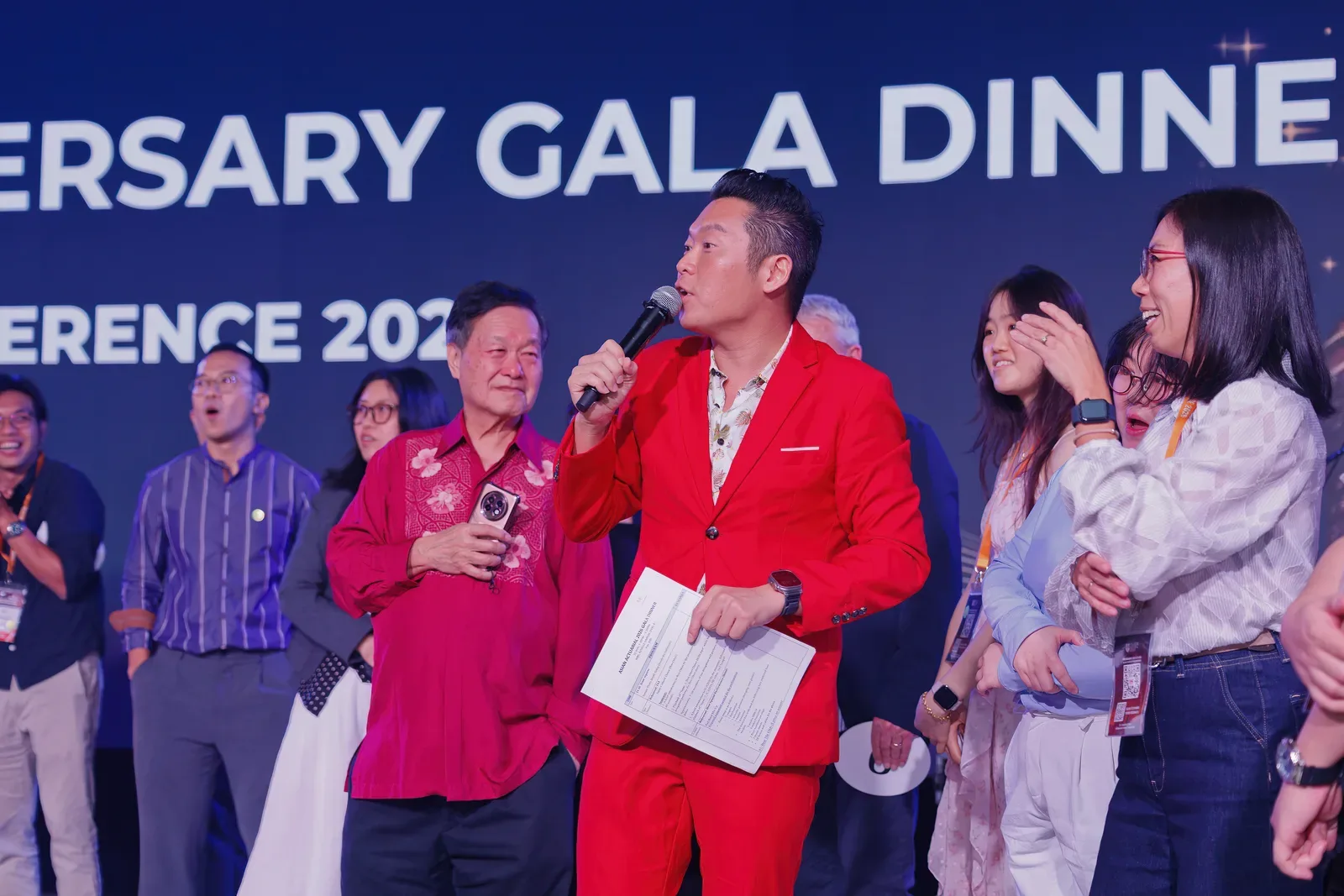 James Yang interviewing guests on stage at the Asian Actuarial Conference 2026