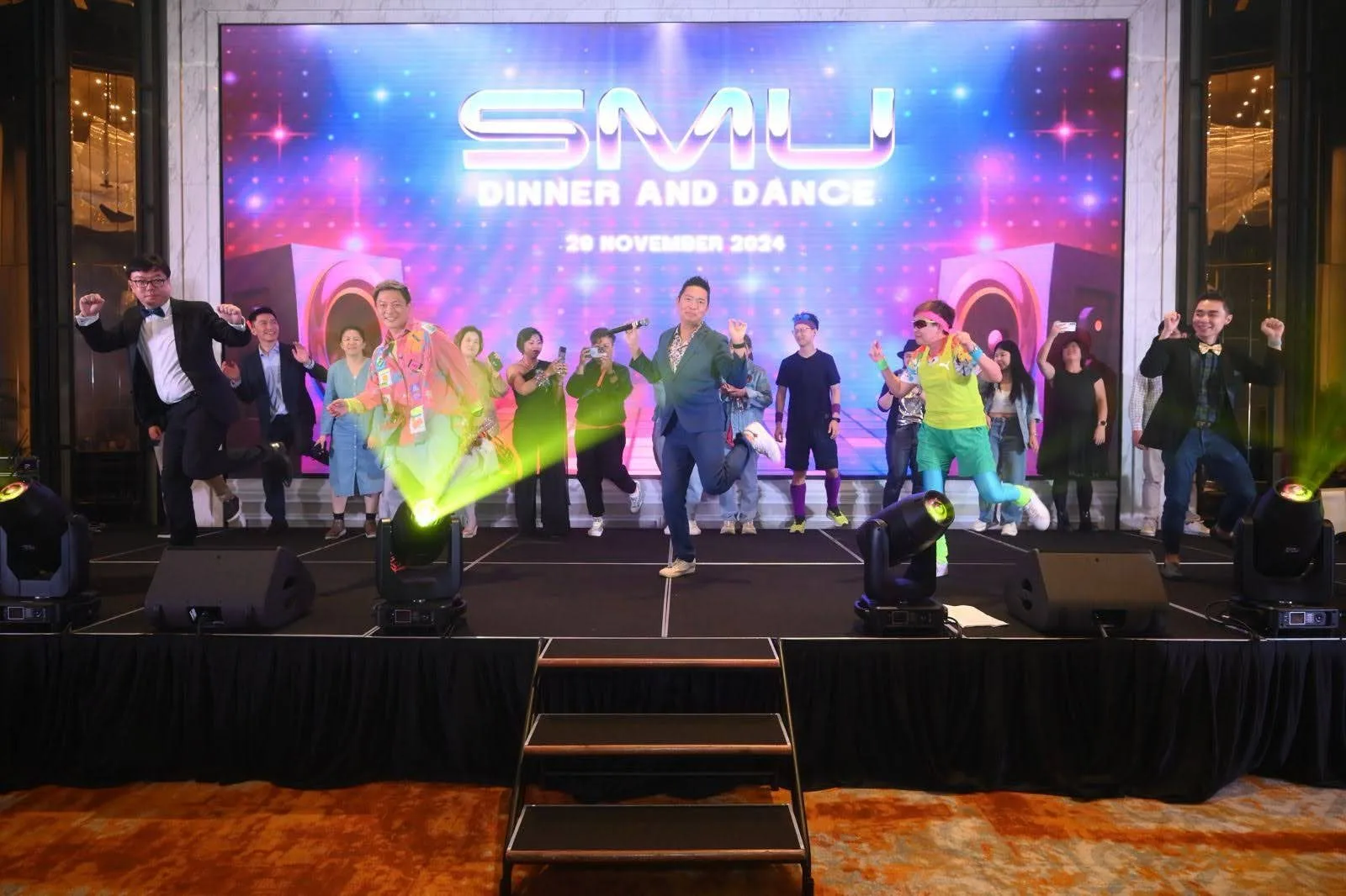 James Yang dancing with guests on stage at the SMU Dinner and Dance, 29 November 2024